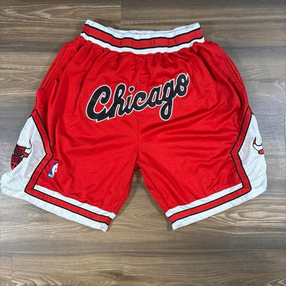 Chicago Bulls red shorts with white trim and black 'Chicago' script #basketball